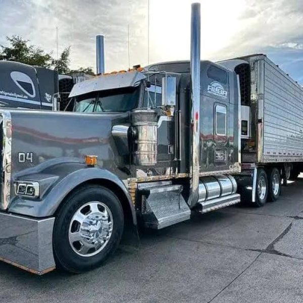 Large semi-truck with trailer for vehicle shipping and auto transport services.